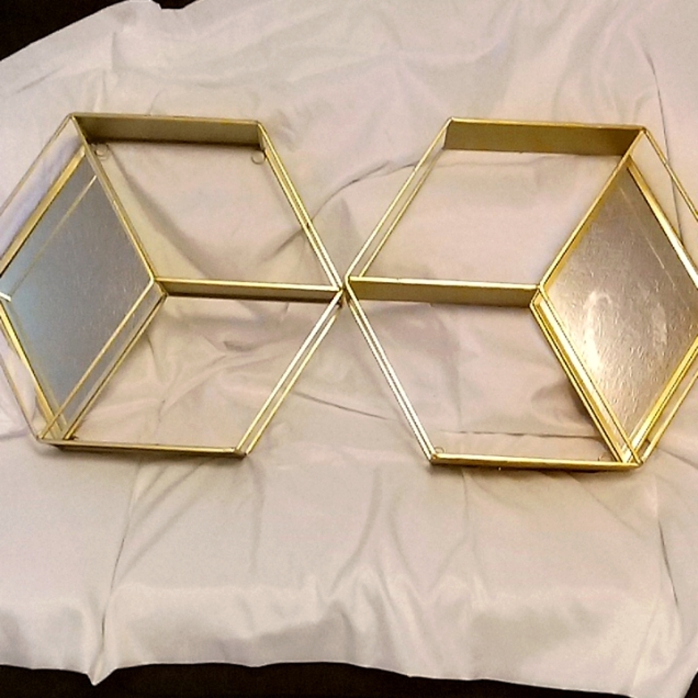 A pair of gold frames with mirror